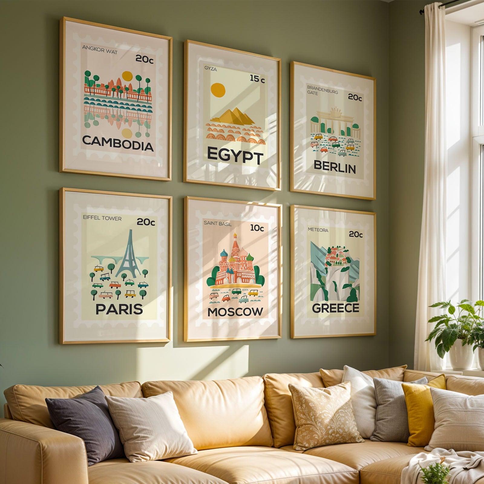 Living room with framed world travel posters on a green wall and a beige sofa.