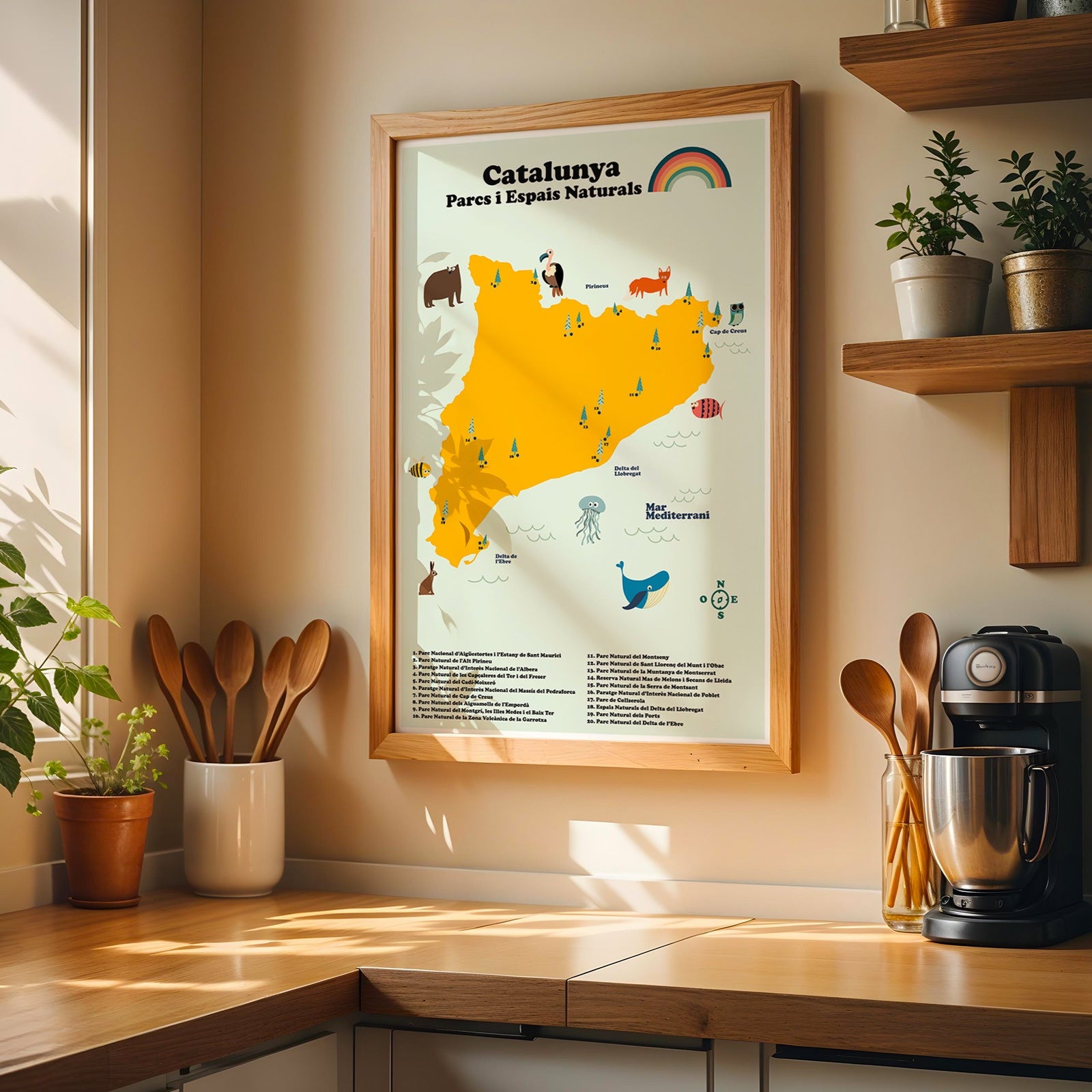 Kitchen corner with a map of Catalonia on the wall, plants, and kitchen utensils.