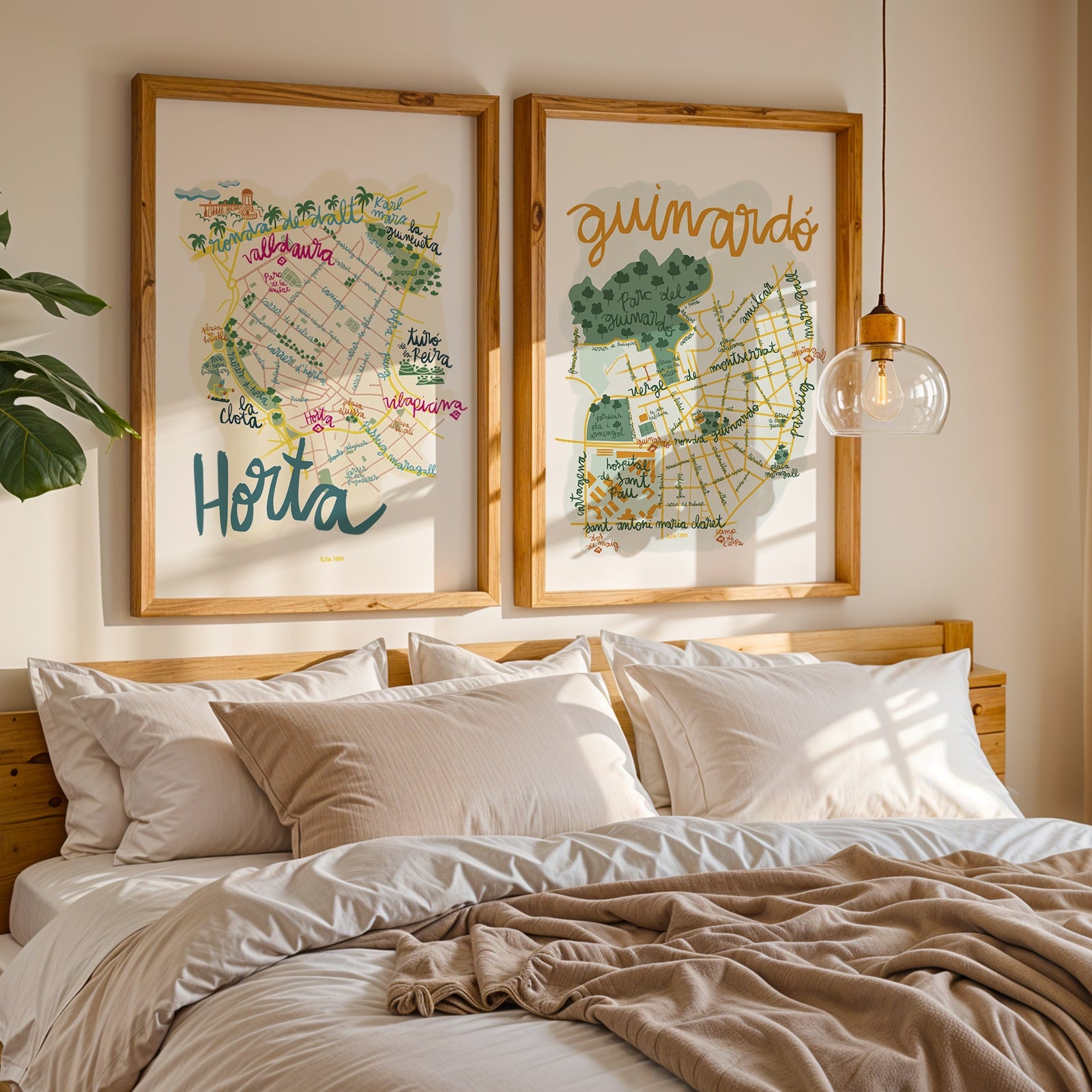 Bedroom with framed maps on the wall above a bed
