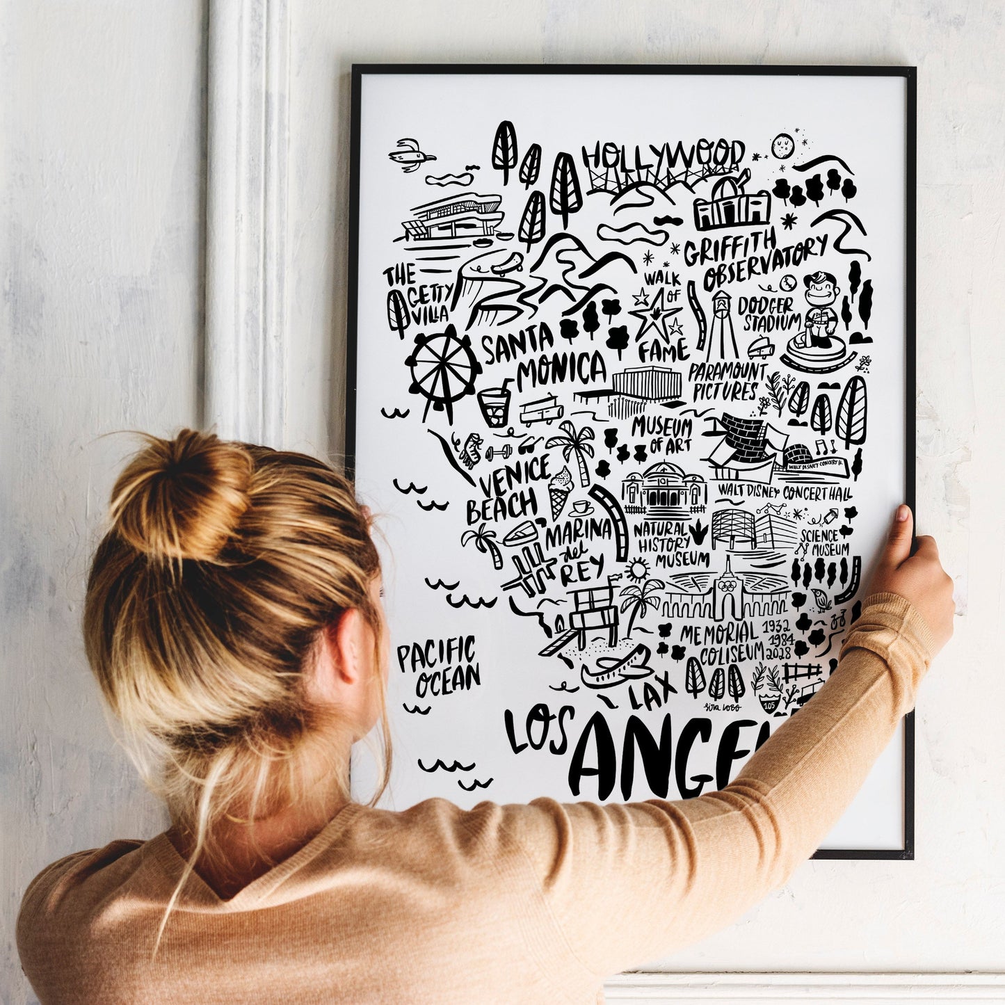 The Los Angeles Illustrated Map, California, is a black-and-white city artwork perfect for adding a touch of West Coast charm to your home decor. Ready-to-hang map with the iconic places and vibe of LA, making it a great souvenir for a travel wall.