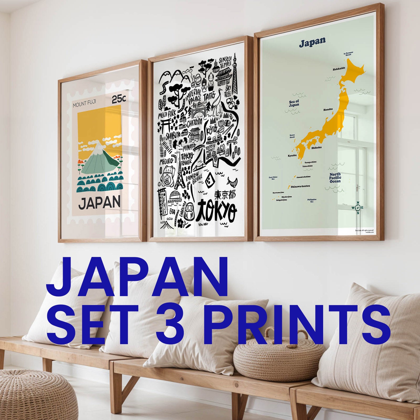 Three framed prints of Japan on a wall above a wooden bench with decorative pillows.