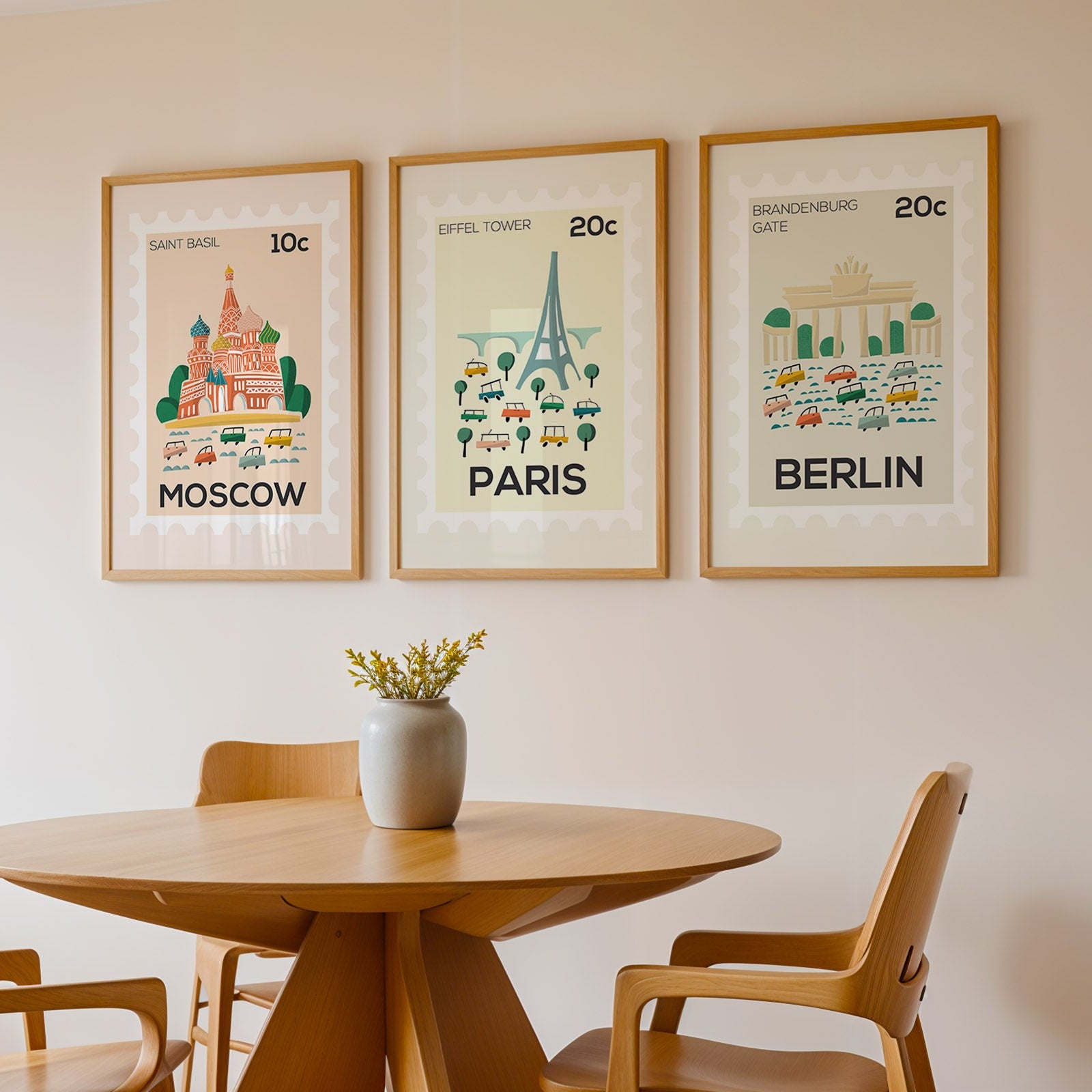 Dining room with framed prints of Moscow, Paris, and Berlin on the wall.