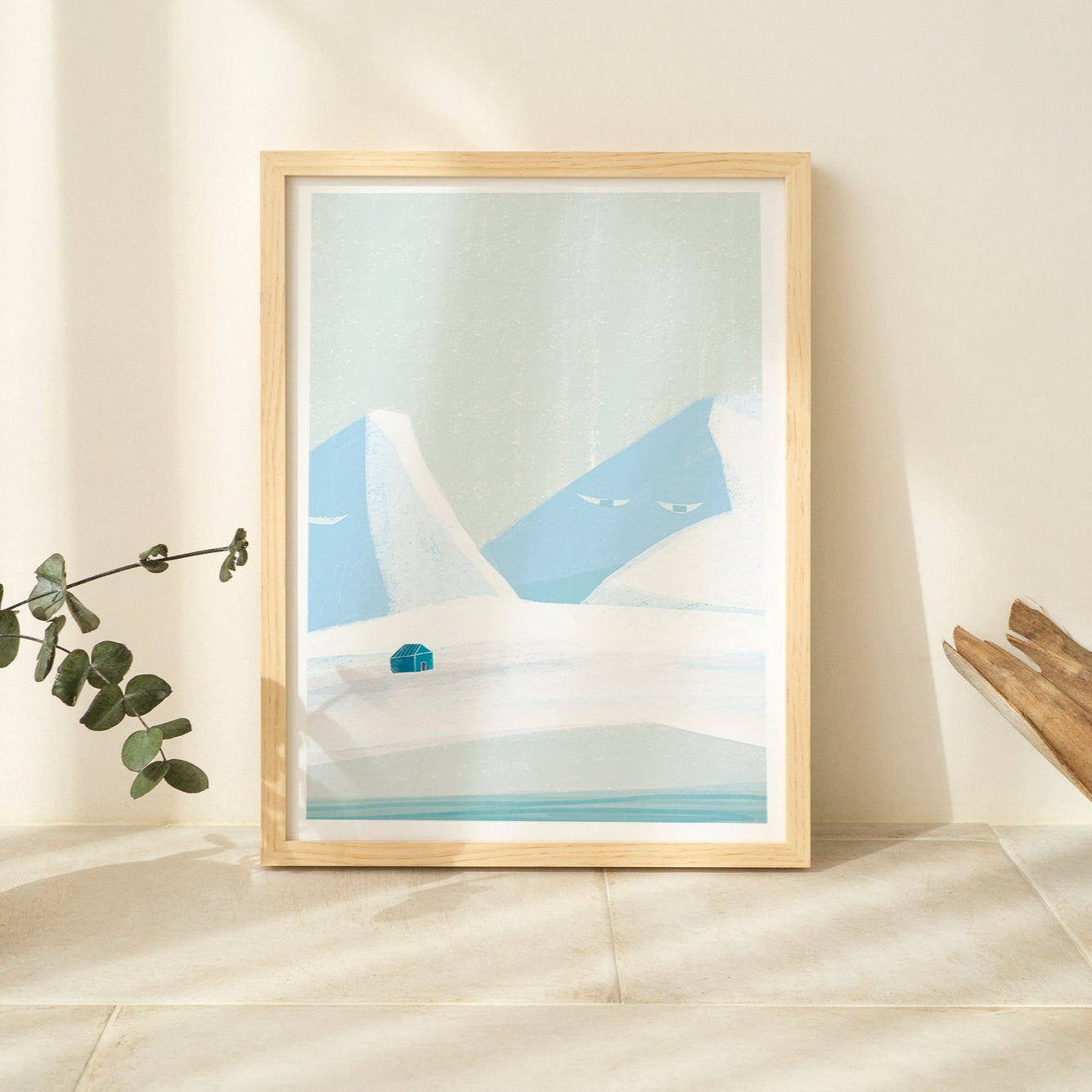 Framed abstract art piece on a wall with decorative elements.