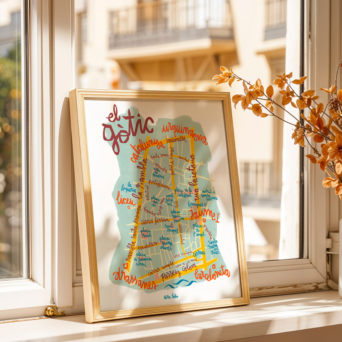 Framed map of El Gotic neighborhood in Barcelona on a windowsill.