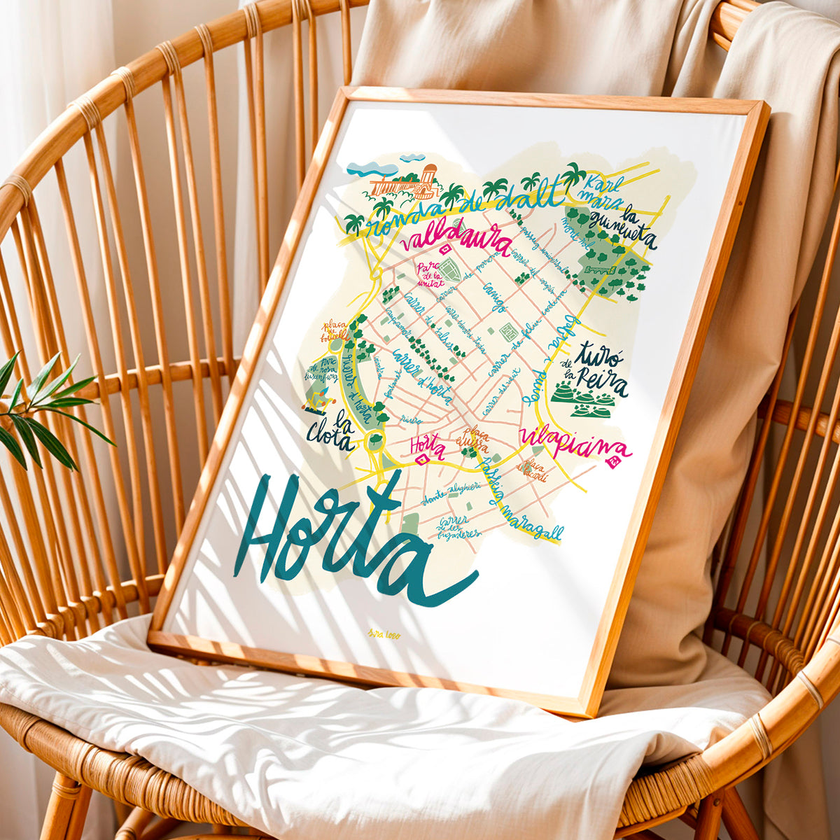 Framed map of Horta on a wicker chair with a neutral background