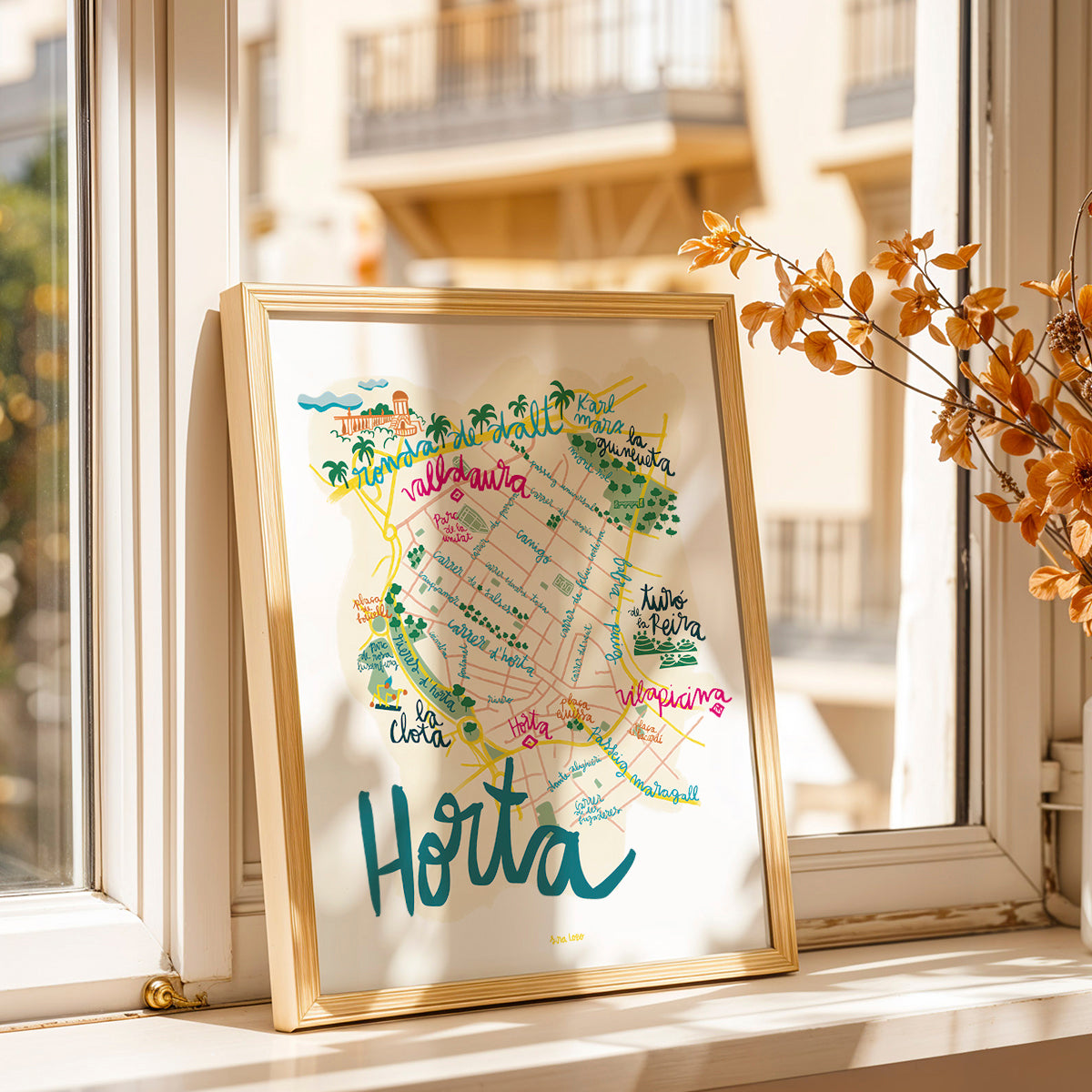Framed map of Horta on a windowsill with a blurred building in the background
