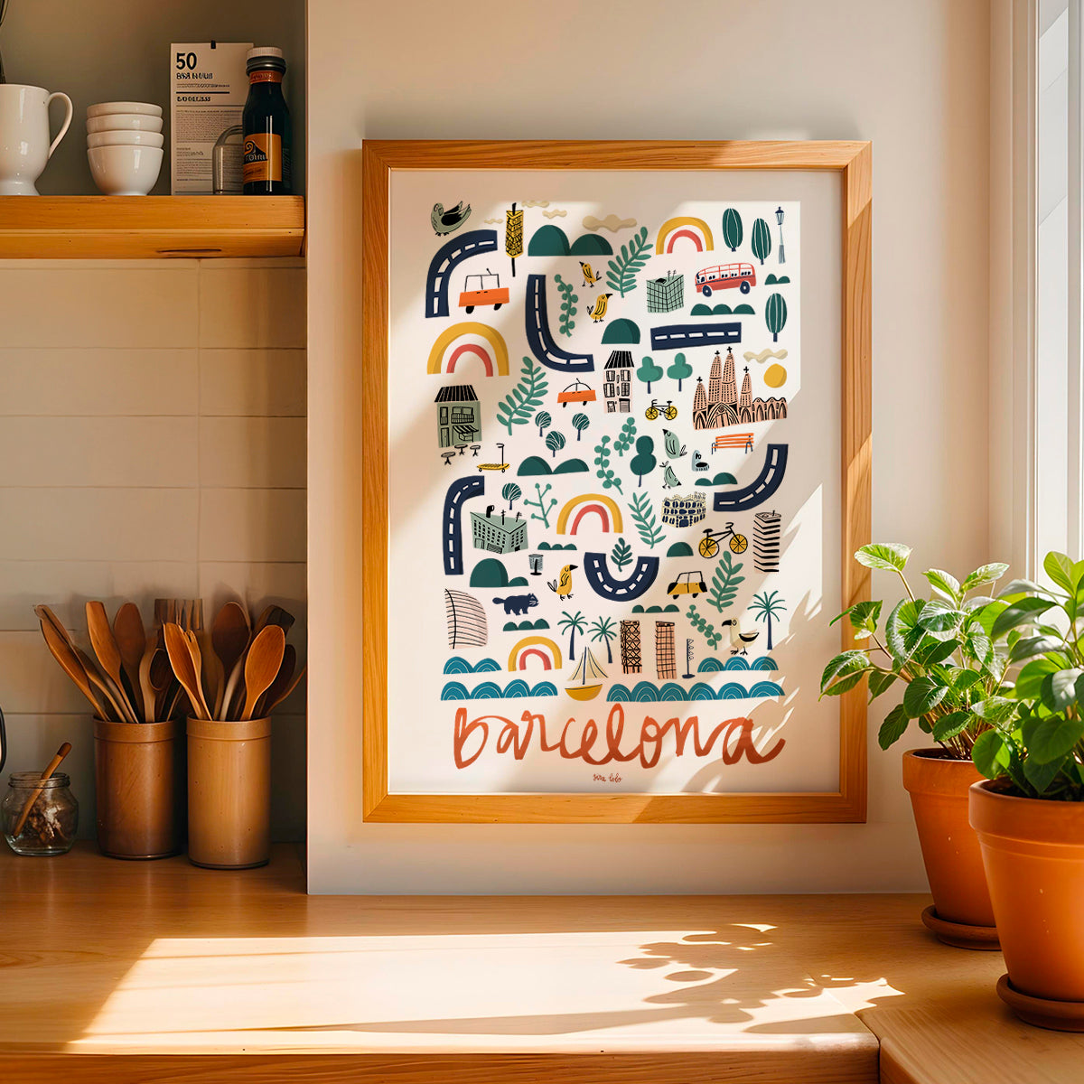 Framed artwork with 'Barcelona' design in a kitchen setting