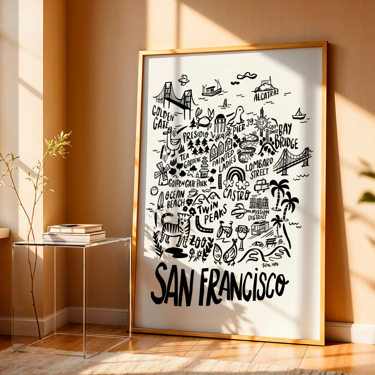 Framed black and white San Francisco map print on a wall.