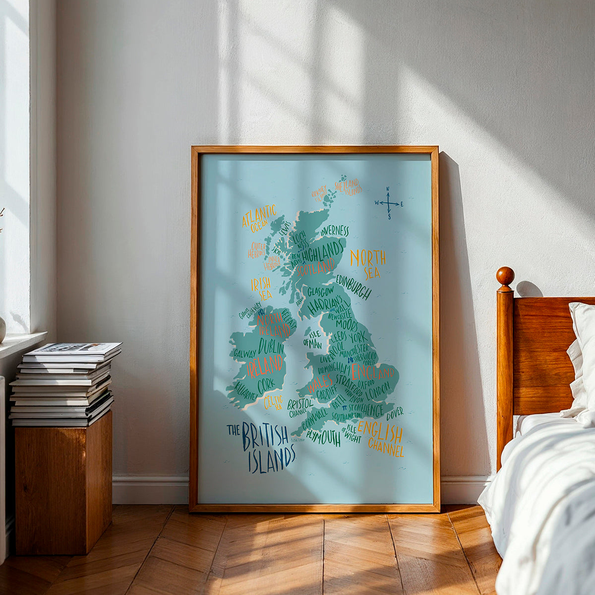 Framed map of the British Isles on a wall in a bedroom