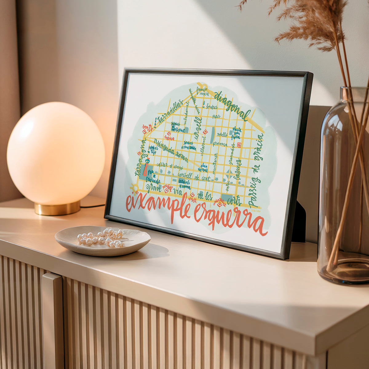 Framed artwork on a table with decorative items