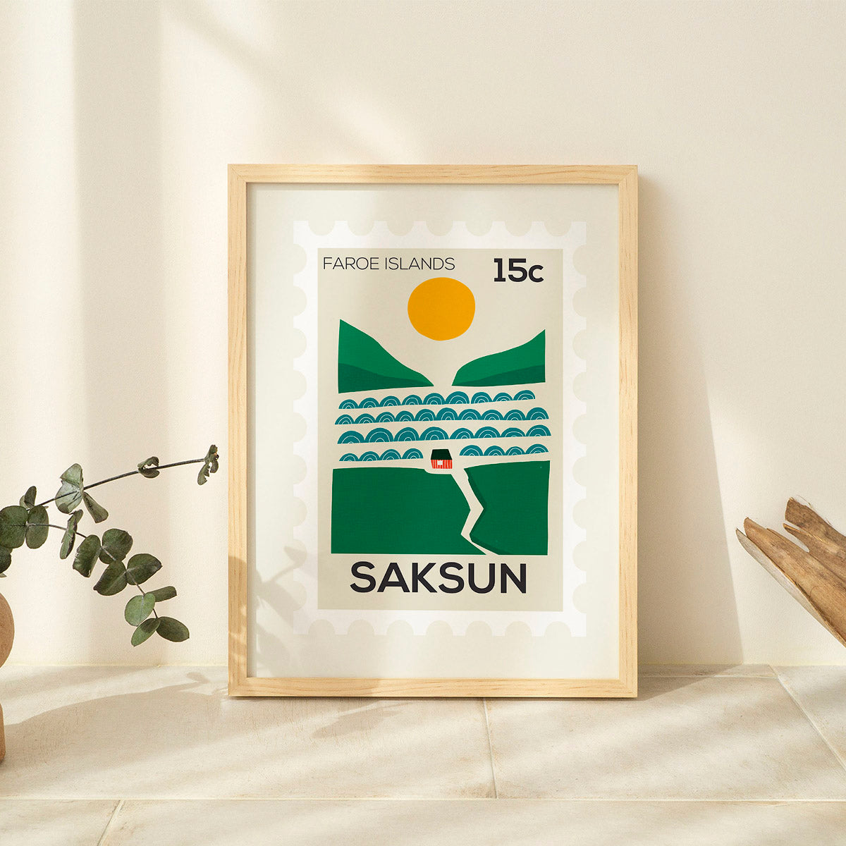 Framed poster of Faroe Islands postage stamp design on a light wall.