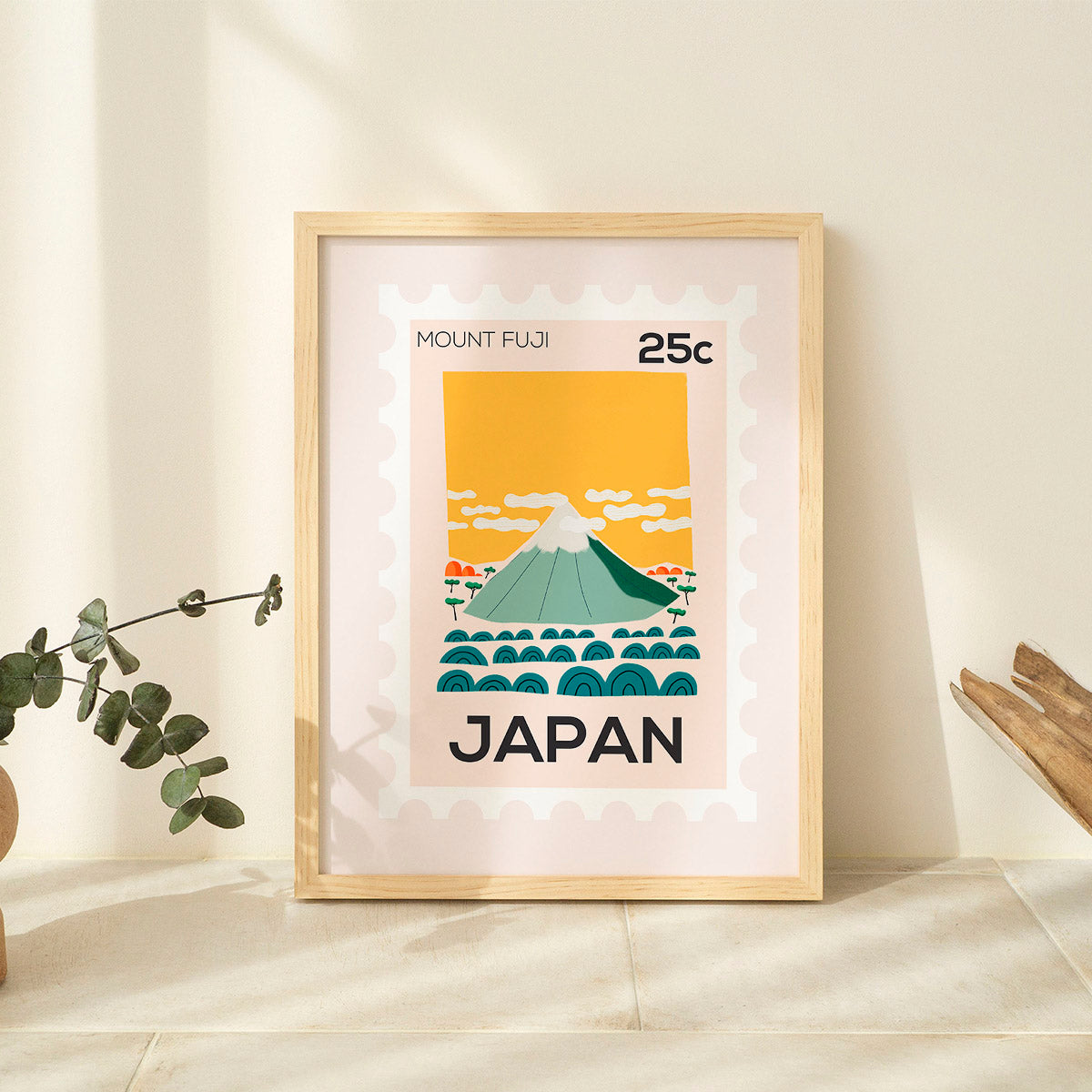 Framed artwork of Mount Fuji with 'Japan' text on a light background
