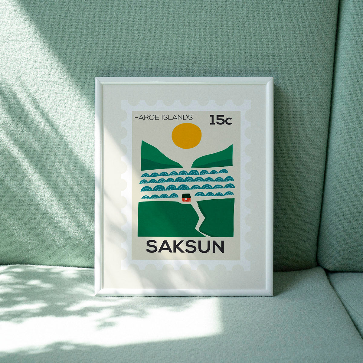 Framed artwork of a Faroe Islands postage stamp design on a light green surface.