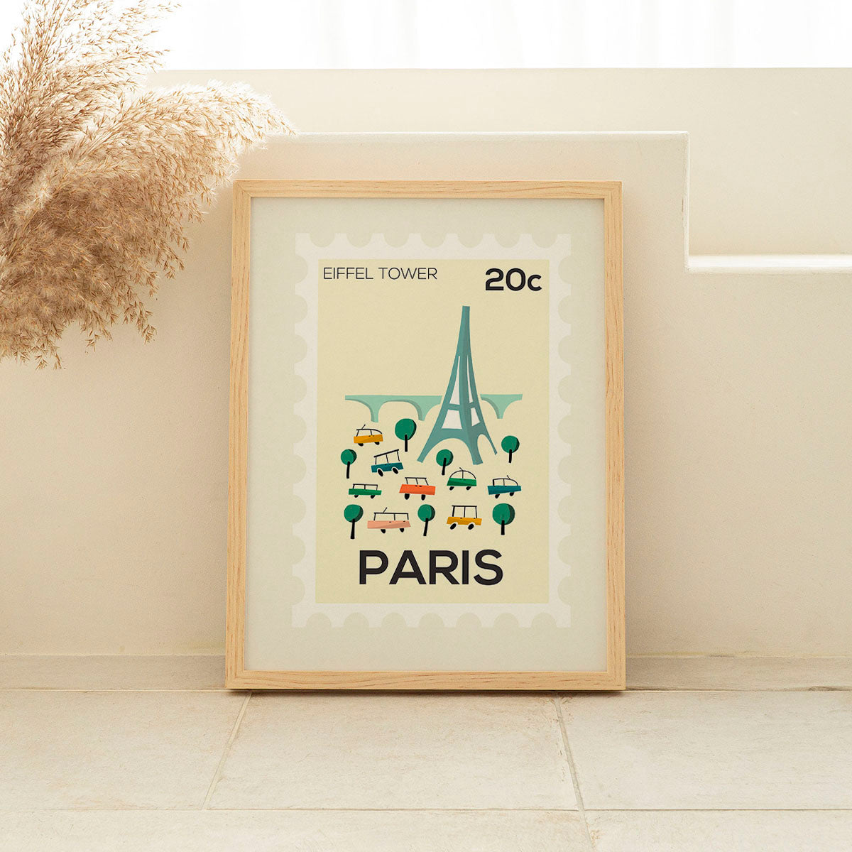 Framed poster of the Eiffel Tower with 'Paris' text on a beige background