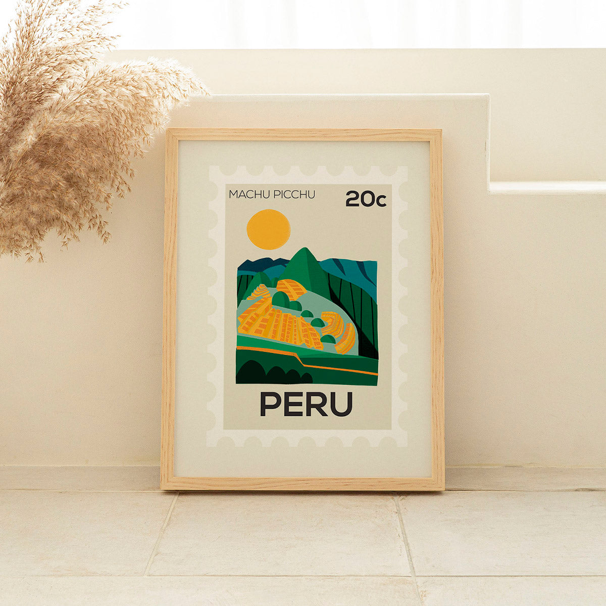 Framed poster of Machu Picchu with 'PERU' text on a light wall.