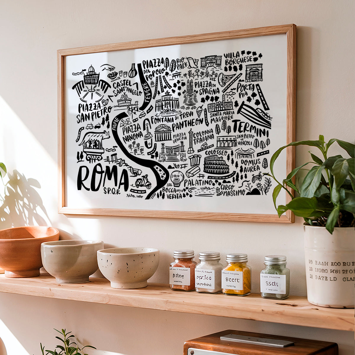 Framed map of Rome on a shelf with decorative items