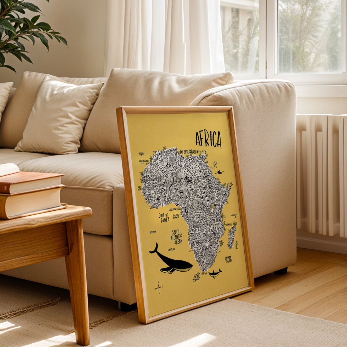 Living room with a framed continental Afrfica on a coffee table