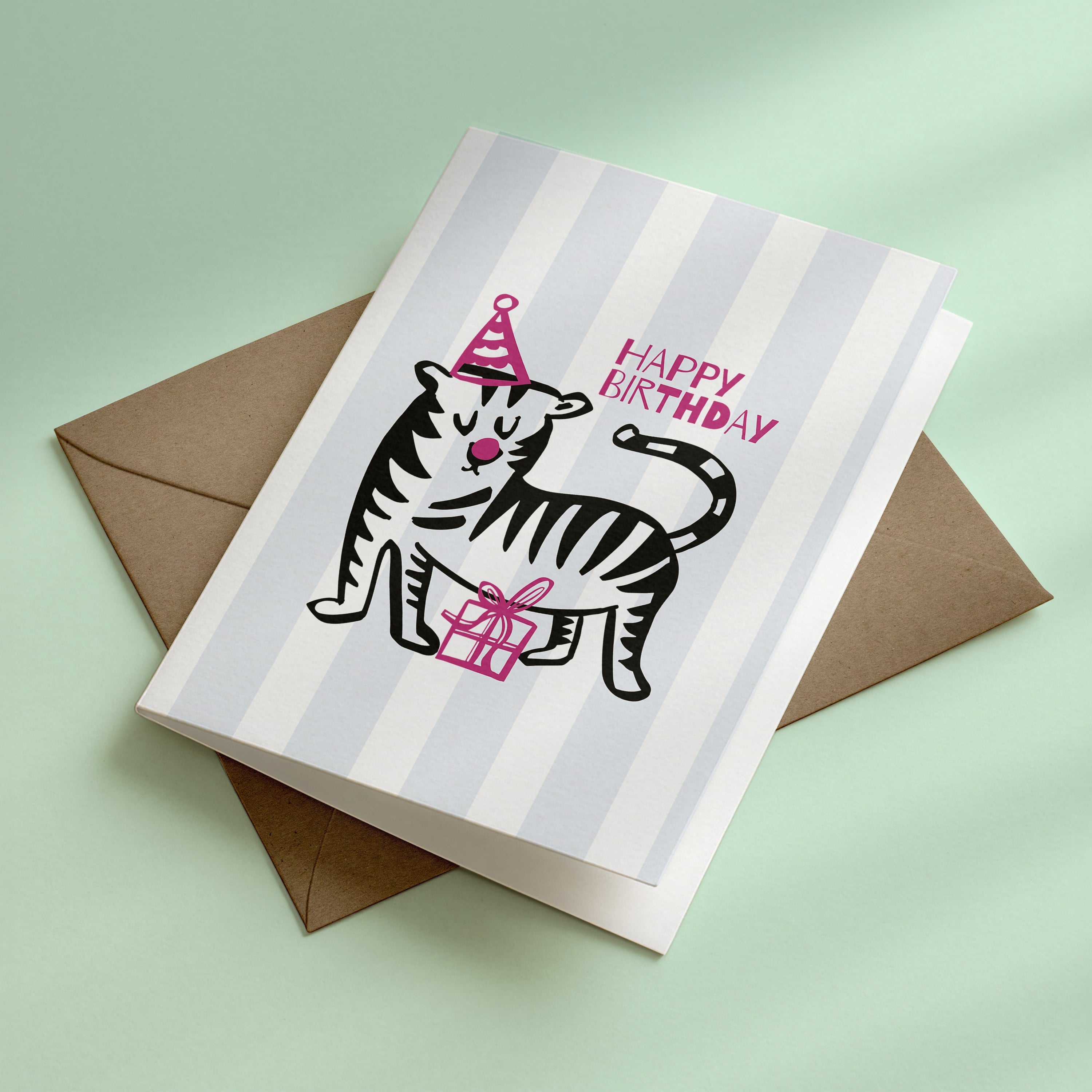 Birthday card with a tiger illustration and 'Happy Birthday' text on a light green background
