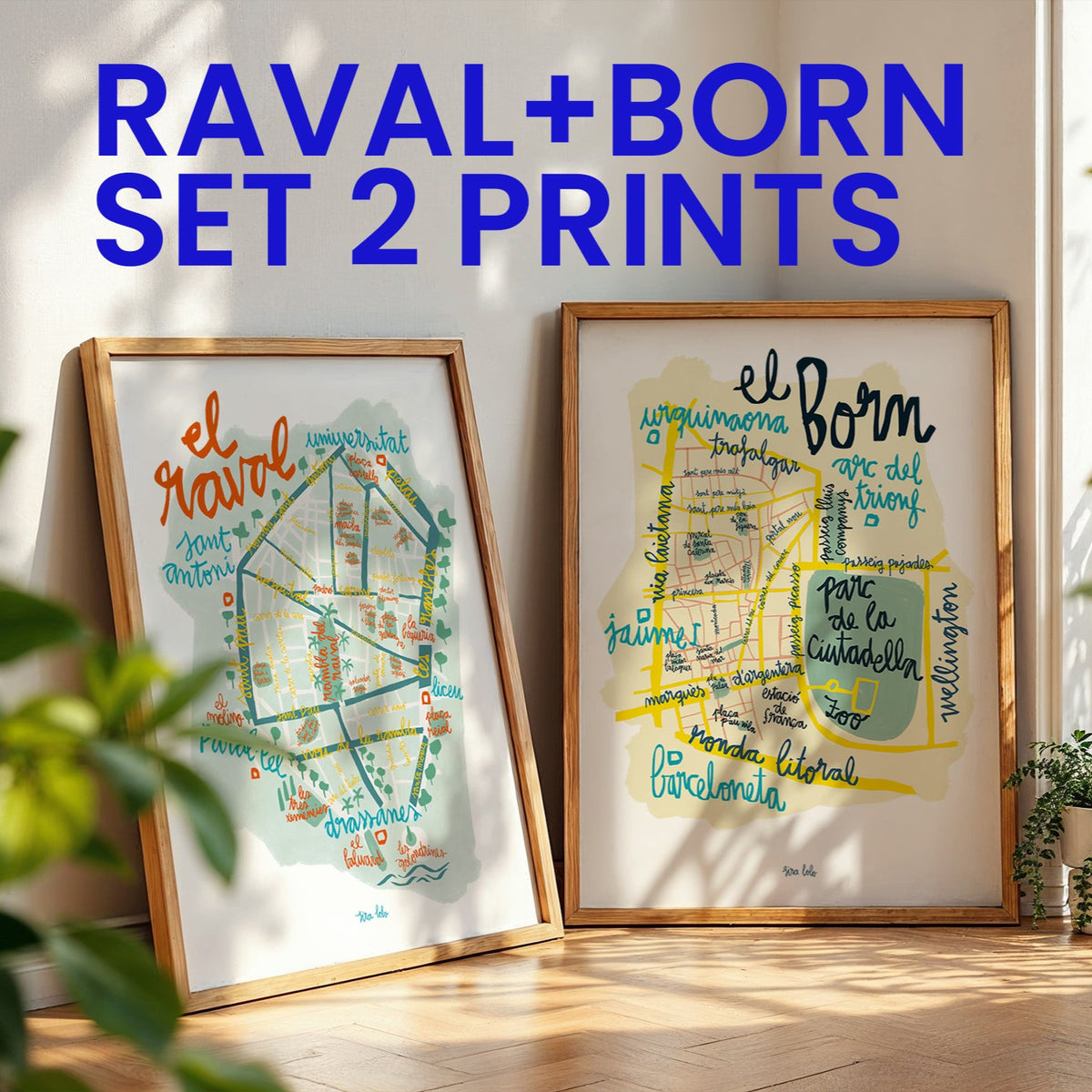 Two framed prints of maps with text, titled 'Raval' and 'Born', in a room with plants and natural light.