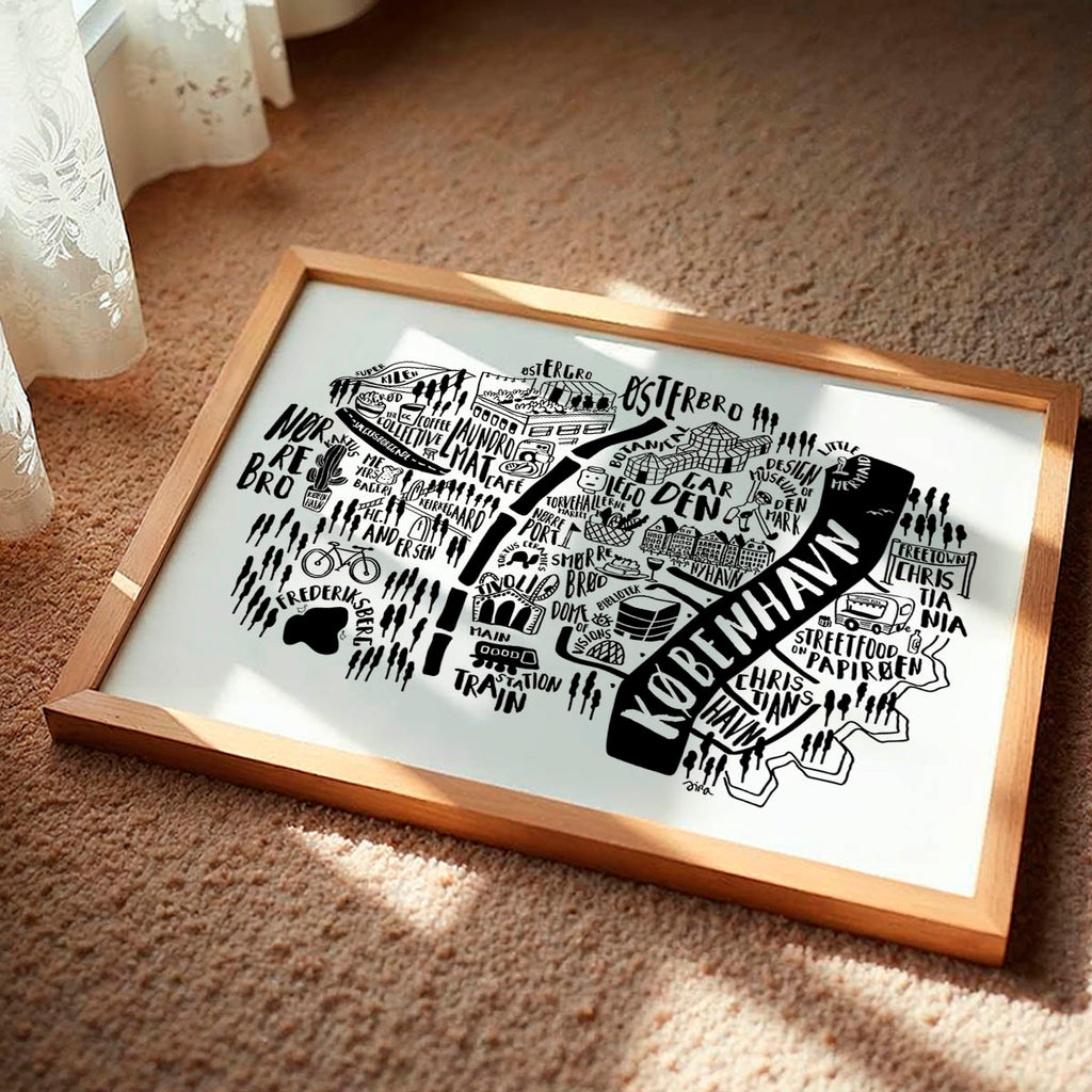 Framed black and white map of Copenhagen on a beige carpet