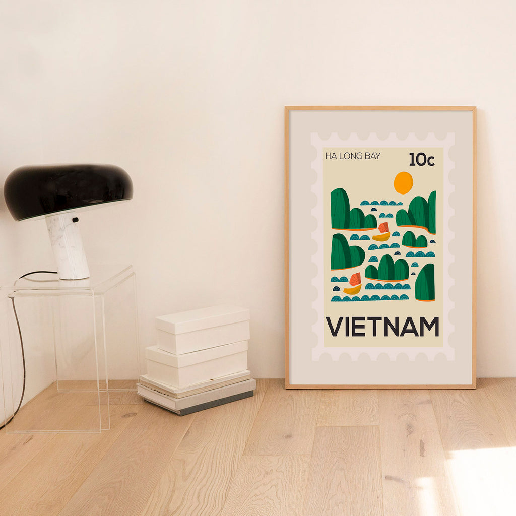 Framed poster of Ha Long Bay, Vietnam on a wall with minimal decor.