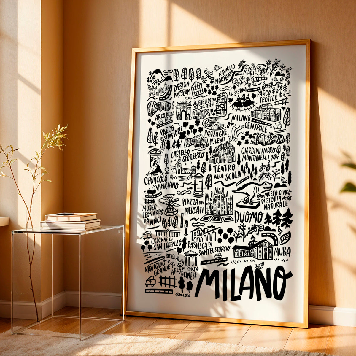 Framed map of Milano with gold frame on a wall