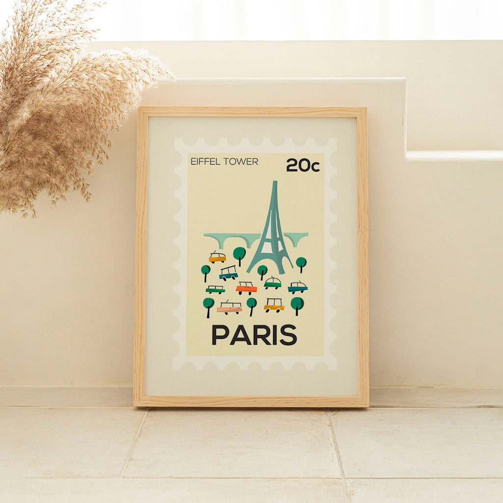 Framed poster of the Eiffel Tower with 'Paris' text on a beige background
